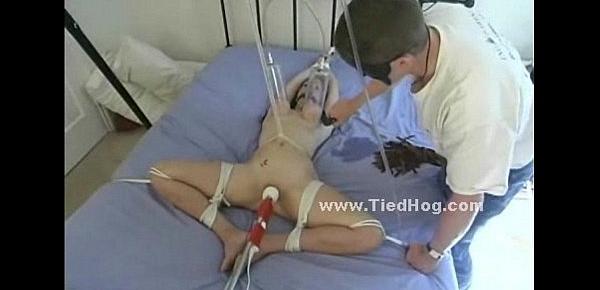  Whore tied in bed immobilized in rope